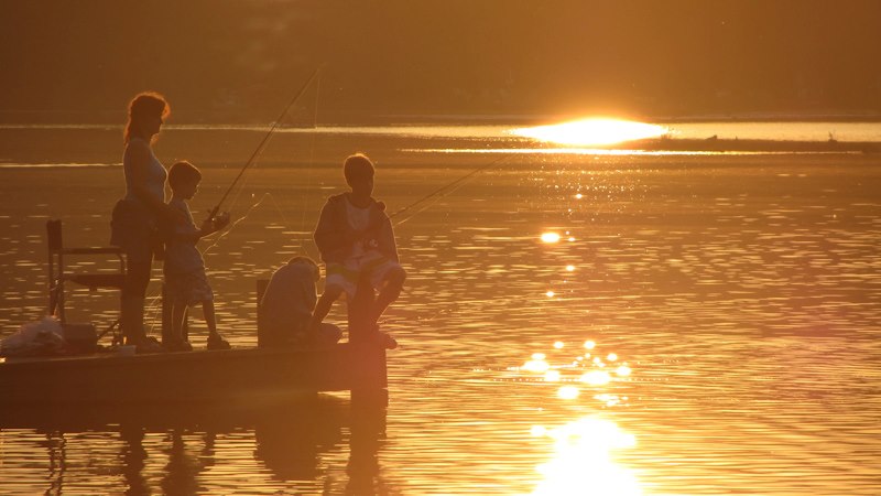 Mom and boys fishing - sunset