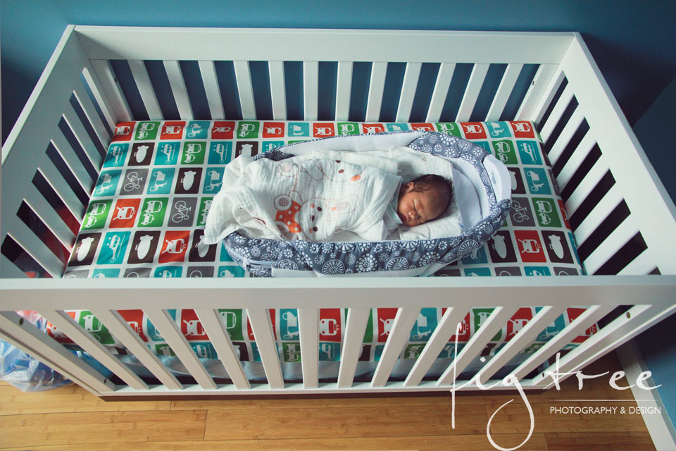 Little newborn in a crib